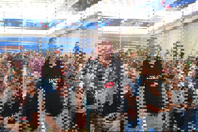 a man standing in front of a large crowd